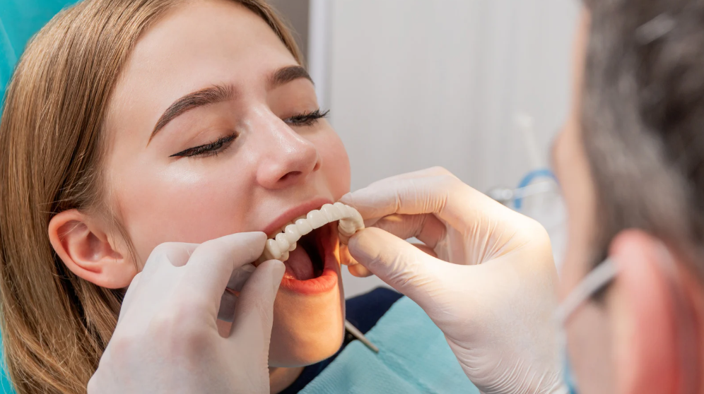 Patient with a confident smile after dentures in Leavenworth, KS at Family Dental Care